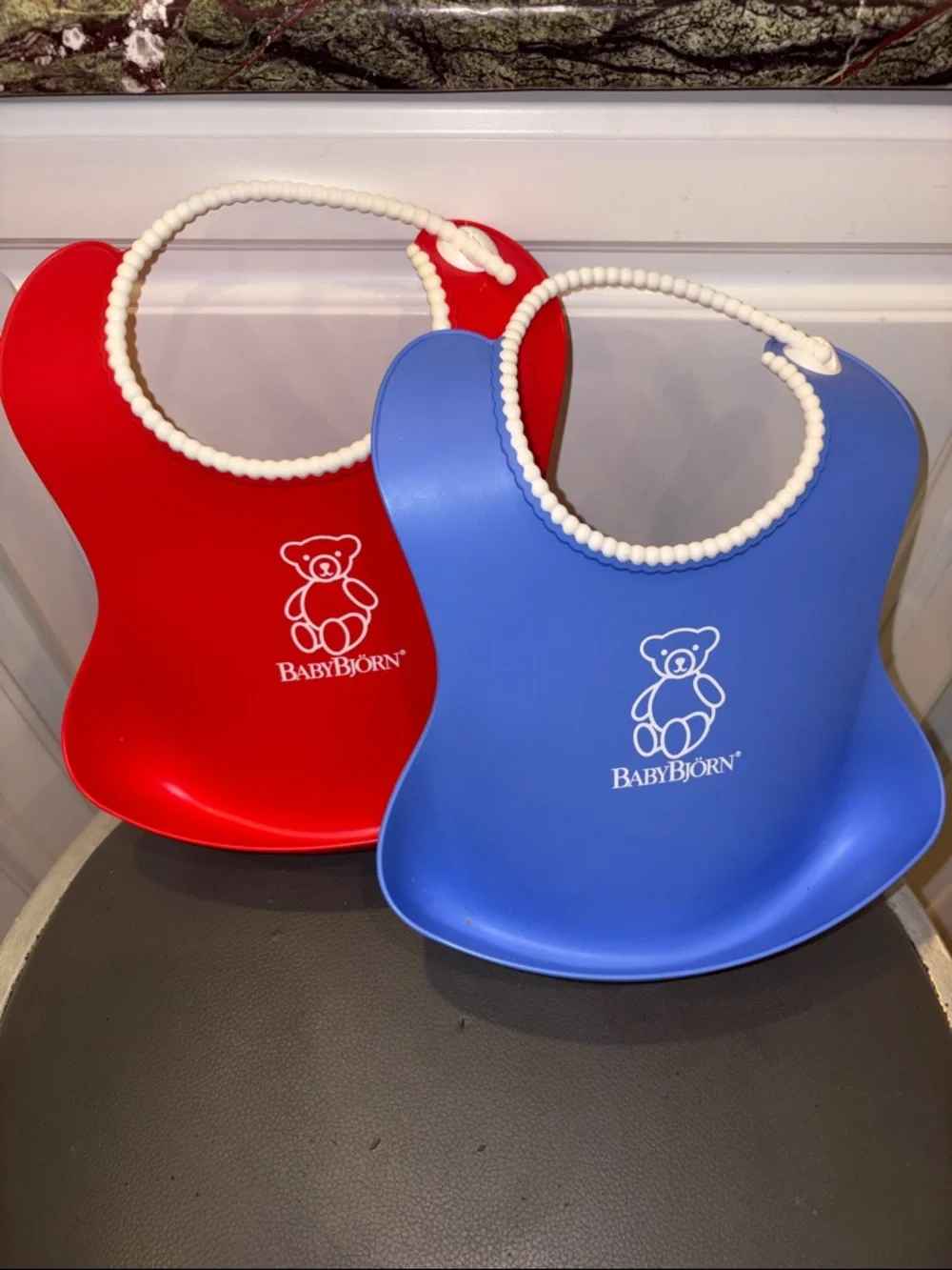 BabyBjörn Soft Silicone Bibs in Blue and Red 2-Pack